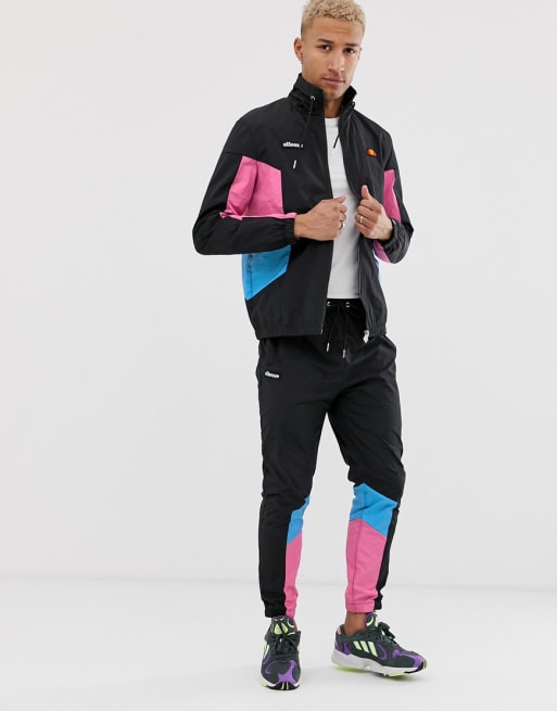 ellesse Trainingspak met roze en blauwe panelen in zwart ASOS