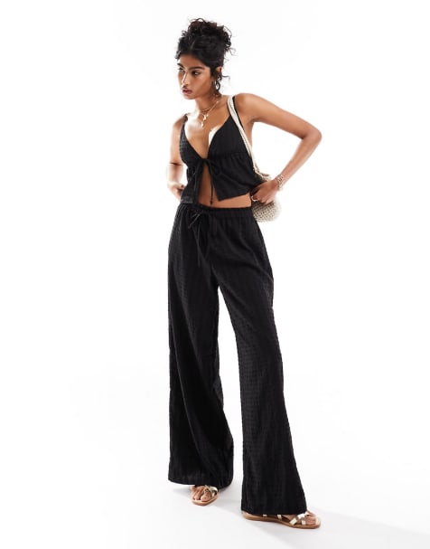 Esmée - Strand co-ord set met crop top en broek in zwart - view 1