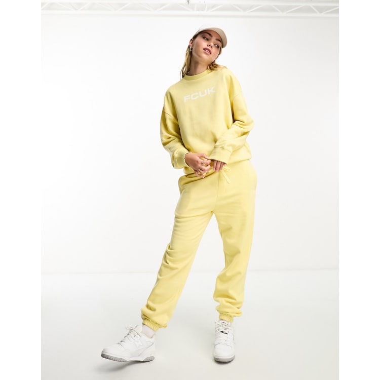 FCUK sweatpants with white logo in lemon - part of a set