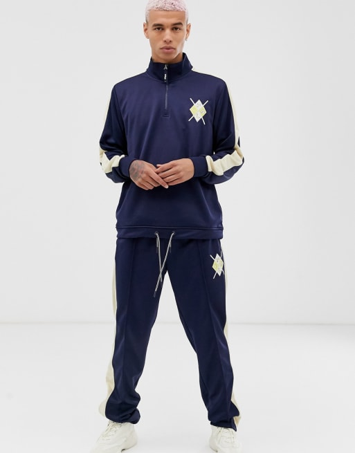 Fila tracksuit bottoms with logo in cream - exclusive to ASOS