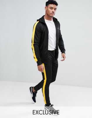 black tracksuit with yellow stripe