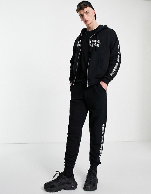 Good For Nothing zip thru hoodie in black with chest and arm logo print