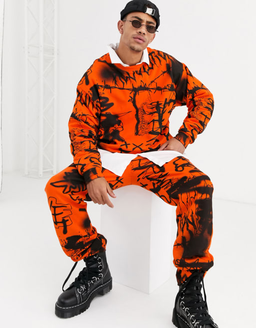 Jaded London - Trainingspak met graffiti-print in oranje