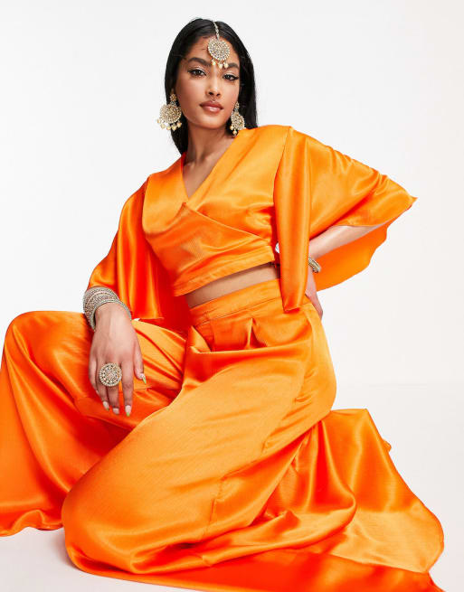 Kanya London - Coordinato con crop top e pantaloni arancione