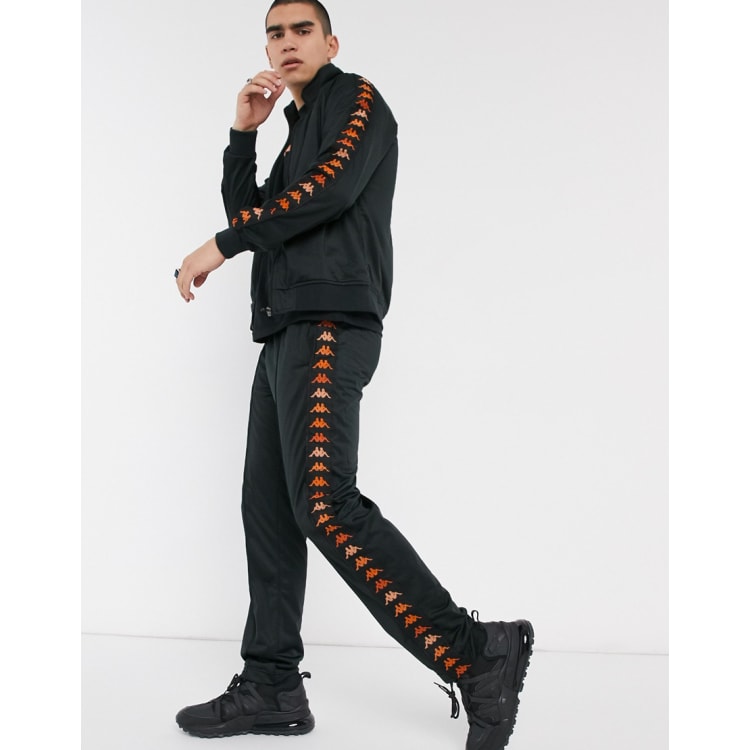 Kappa tracksuit with orange taping on black ASOS