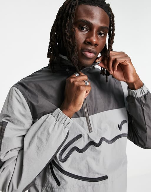 Karl Kani – Grå, blockfärgad träningsoverall med signaturlogga