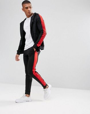 red tracksuit with white stripes