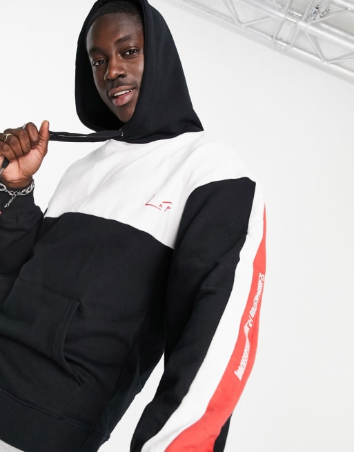 Liquor N Poker - Oversized joggingpak in zwart met rode en witte vlakken op de mouwen