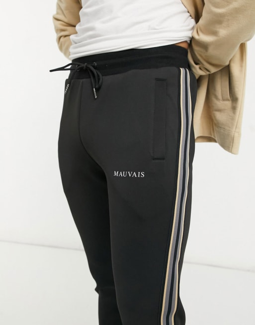 Mauvais track co-ord set in black with contrast piping