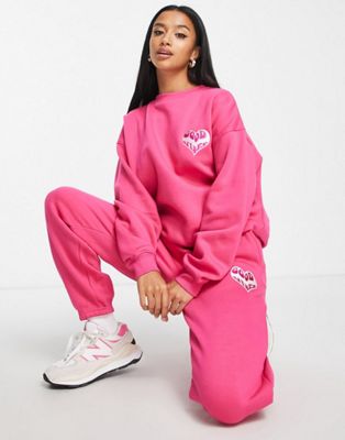 Missguided Petite good vibes jogger co-ord in bright pink