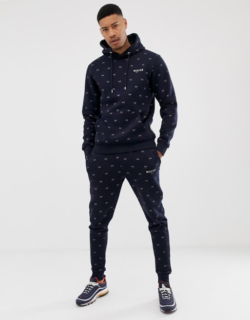 Nicce tracksuit with all over logo in navy | ASOS