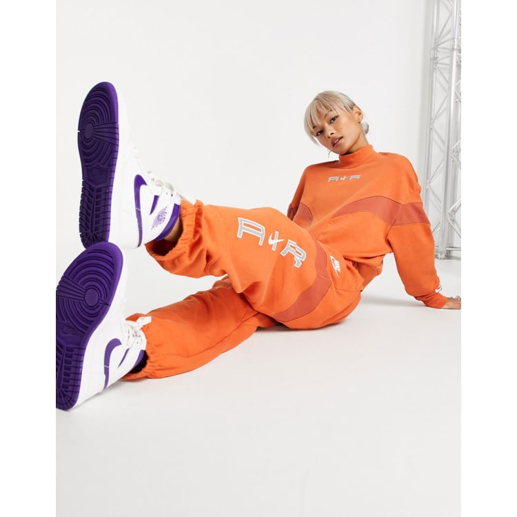 Nike orange tracksuit womens hot sale