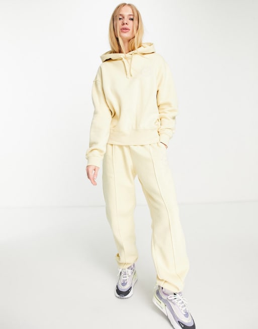 Nike clear the mind mini swoosh joggers in lemon yellow