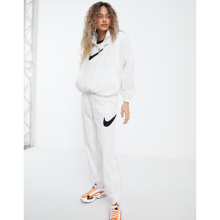 Nike big tick tracksuit best sale