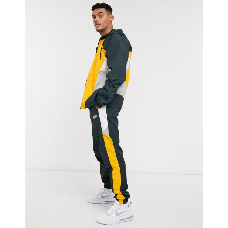 Nike black cheap and yellow tracksuit