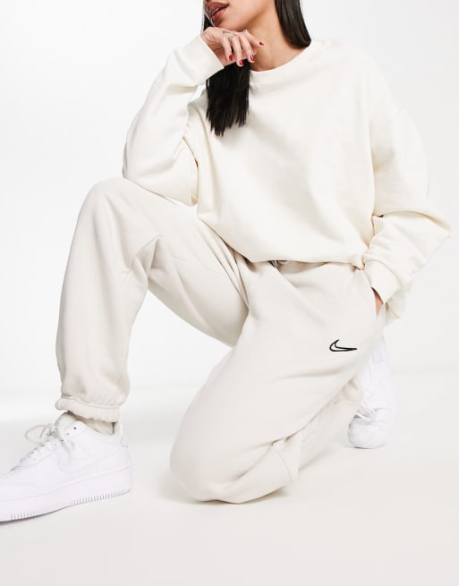 Nike Midi Swoosh phoenix fleece tracksuit in light orewood brown | ASOS