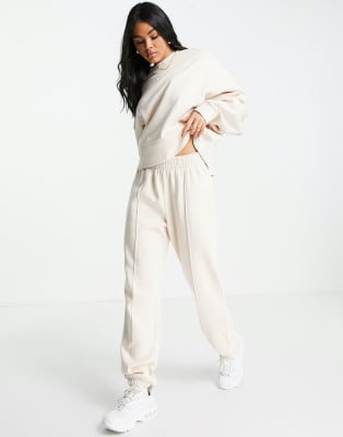 Nike mini swoosh oversized tracksuit in pearl white | ASOS