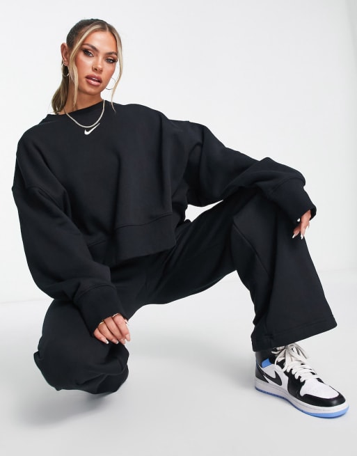 Nike mini swoosh high rise wide leg joggers in black and sail