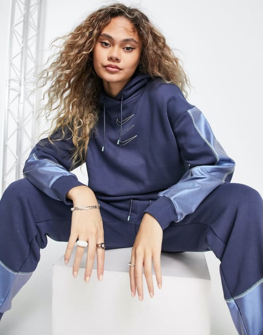 Nike - Oversized fleece trainingspak in marineblauw en iriserend