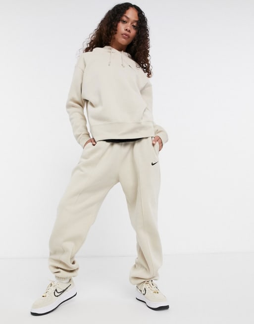 seinpaal taxi Toeval Nike - Oversized trainingspak met swoosh in lichtbeige | ASOS