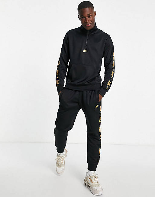 Nike Repeat logo taping tracksuit in black and gold | ASOS