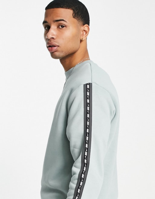 Nike Repeat Pack logo taped tracksuit in sage | ASOS