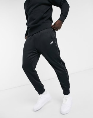 Nike Repeat Pack logo taping polyknit tracksuit in black | ASOS