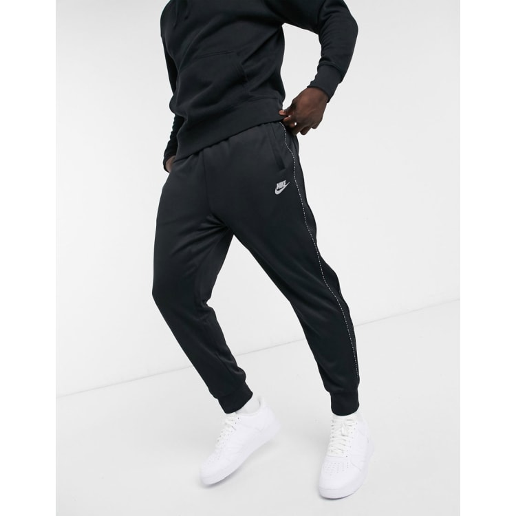 Nike gel tape cuffed track hot sale pants black