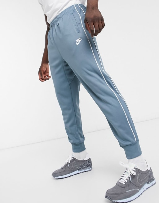 Nike Repeat Pack logo taping polyknit tracksuit in steel blue | ASOS