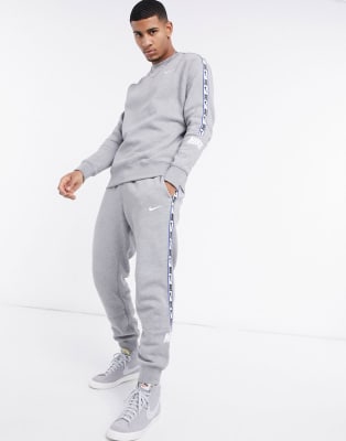 nike logo taping cuffed joggers in grey