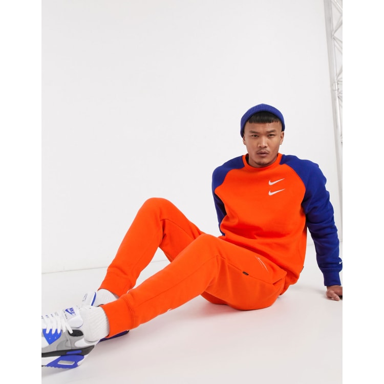 orange tracksuit nike