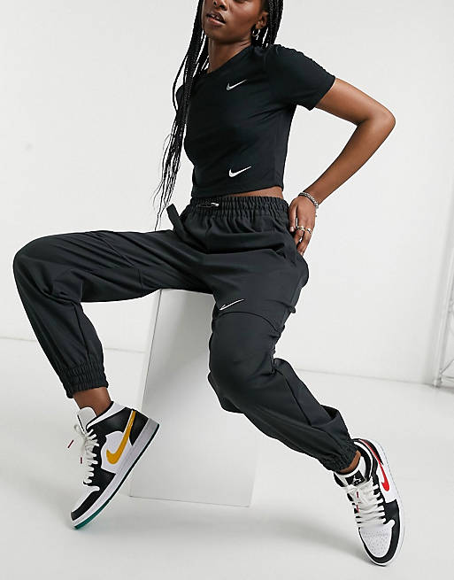 Nike Swoosh woven skirt in black with utility pockets