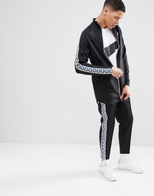 black nike tracksuit white stripe