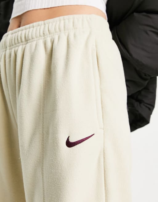 Nike Unisex plush mini swoosh fleece tracksuit in rattan beige | ASOS