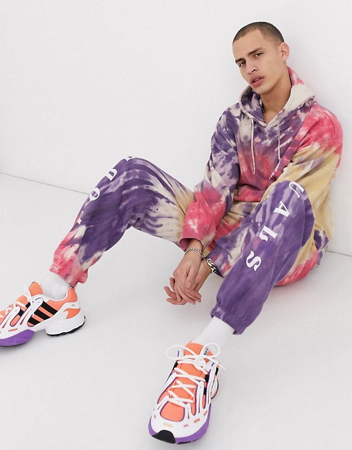 Nothing is Sacred tie dye tracksuit with white print in pink