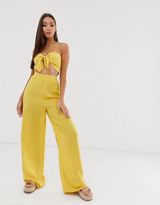 PrettyLittleThing bandeau beach top & trouser co-ord in yellow