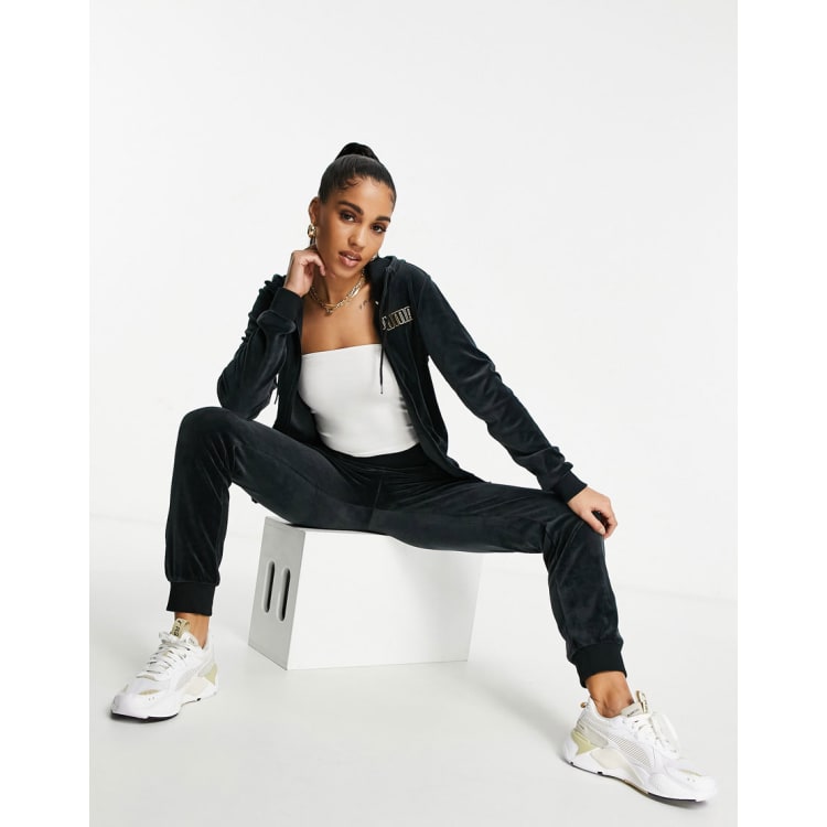 Puma velour tracksuit in black and gold ASOS