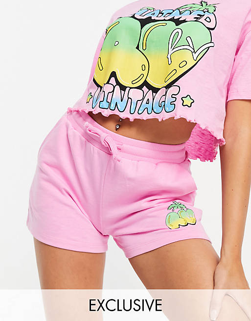 Reclaimed Vintage inspired cropped t-shirt with cartoon logo print in pink co-ord