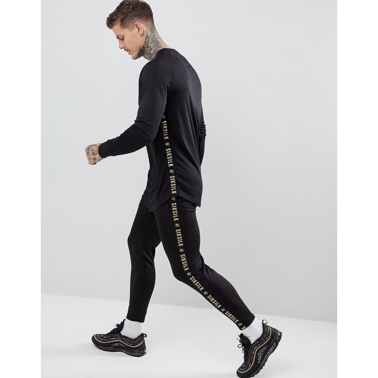 SikSilk Tracksuit In Black With Gold Side Stripe ASOS