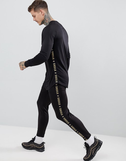 SikSilk cropped jogger in black with gold side stripe