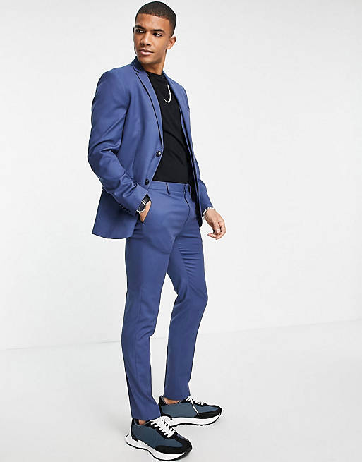 Skinny fit blue trousers and waistcoat with green jacket