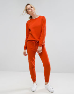 Nike - Rally Burnt - Pantalon de jogging à logo - Orange, ASOS