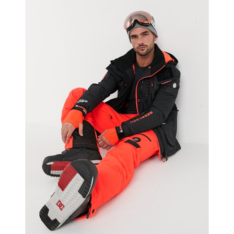 Superdry Snow suit in black orange ASOS