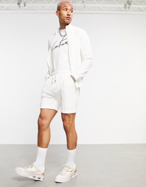 The Couture Club x ellesse – Vicente – Krämvitt set med logga