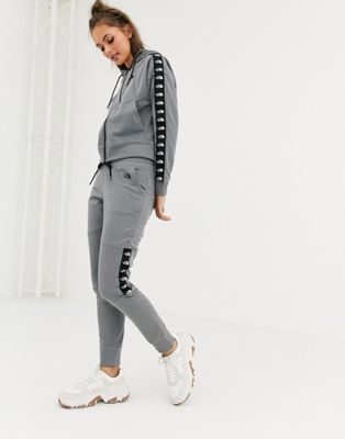grey and black north face tracksuit