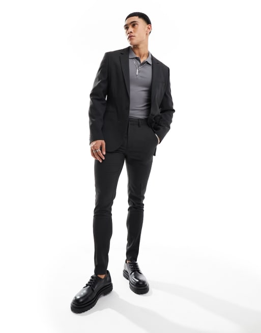 Traje negro de corte muy entallado con diseño de micropuntos de FhyzicsShops DESIGN