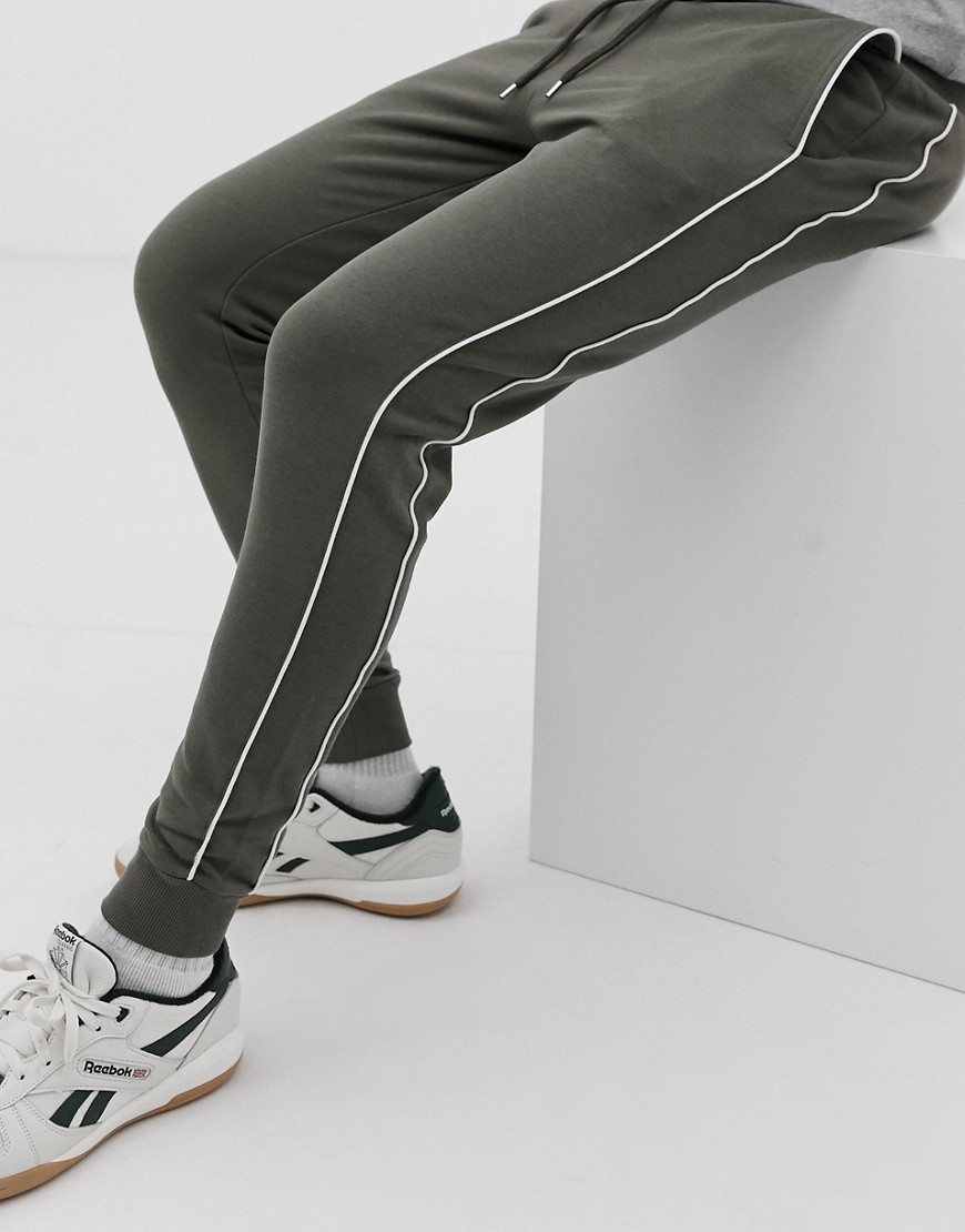 ASOS DESIGN skinny joggers with piping in khaki