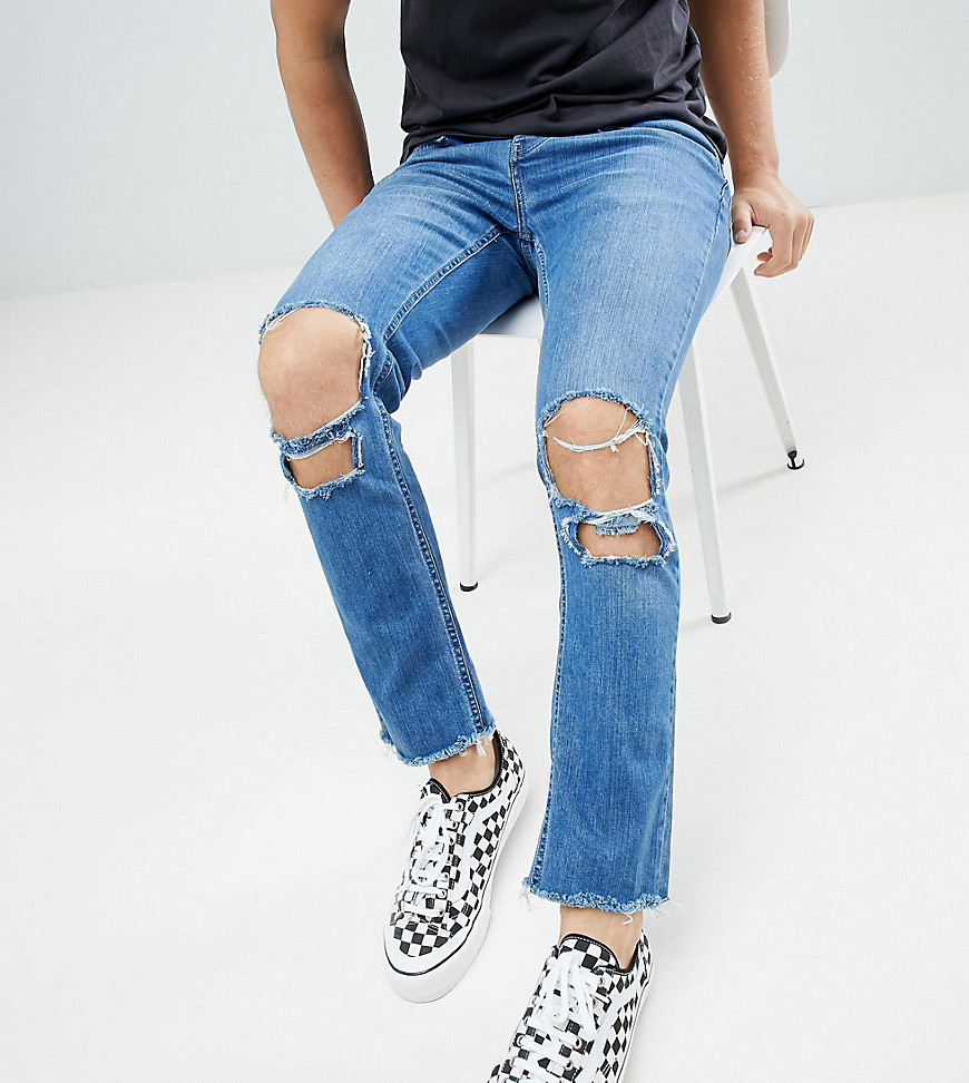 Mennace relaxed super skinny cropped jeans with rips and raw hem in mid wash