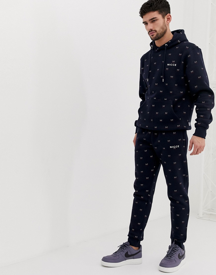 Nicce skinny joggers with all over print in navy