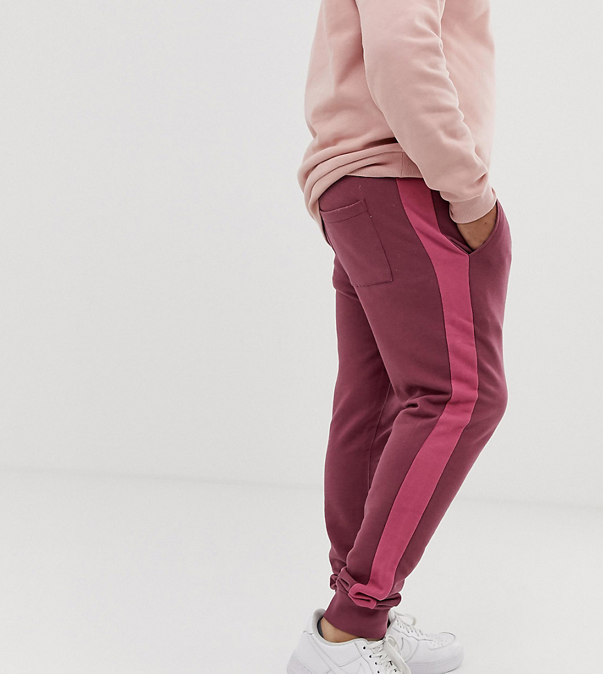 ASOS DESIGN Plus skinny joggers with side stripe in purple